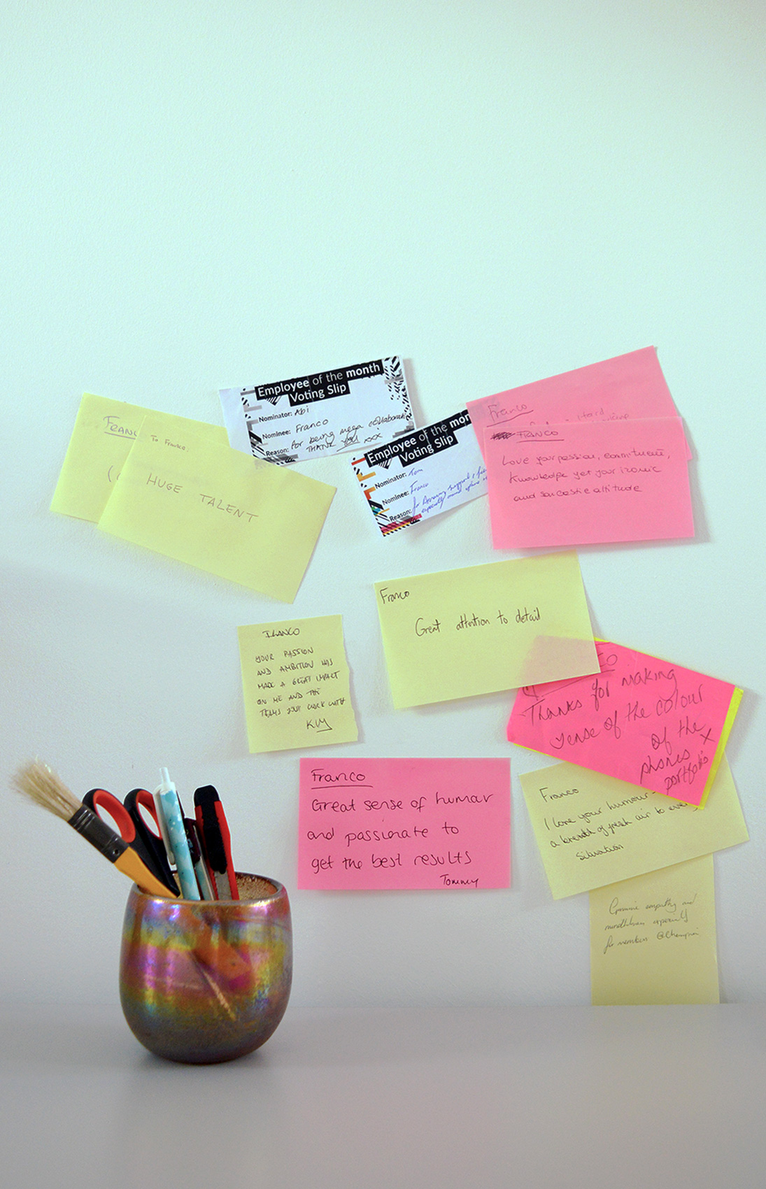 A picture with post its where colleagues have written positive feedback as we worked together